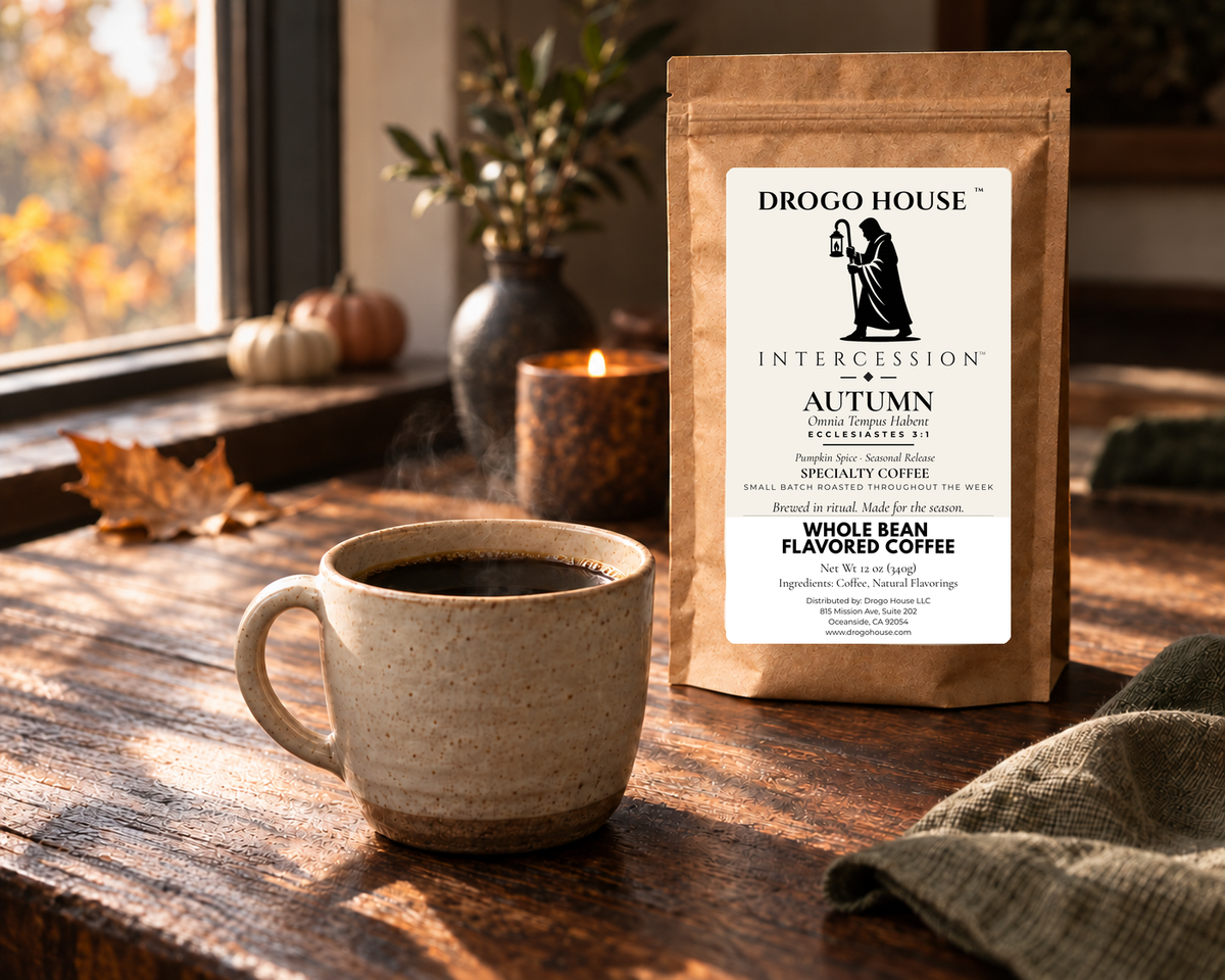 Drogo House Autumn coffee ritual with a cup, candlelight, and small pumpkins in the background